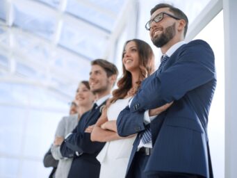 Diverse team of professionals looking forward, choosing an interim manager with Diktu