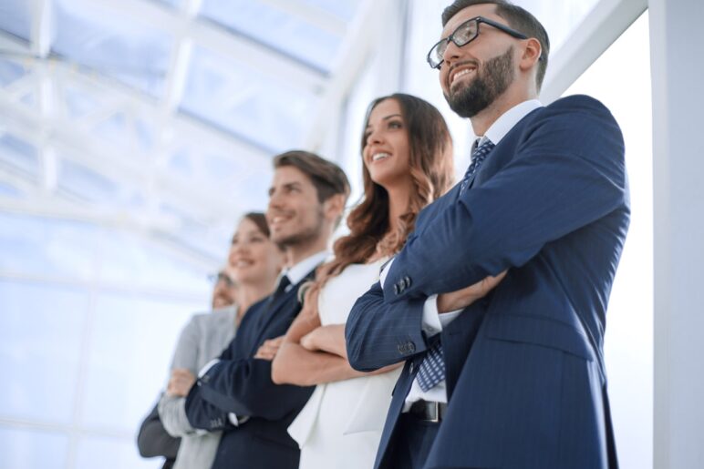 Diverse team of professionals looking forward, choosing an interim manager with Diktu